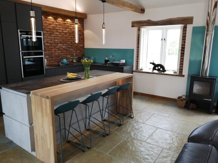 A modern, industrial style kitchen for a converted barn
