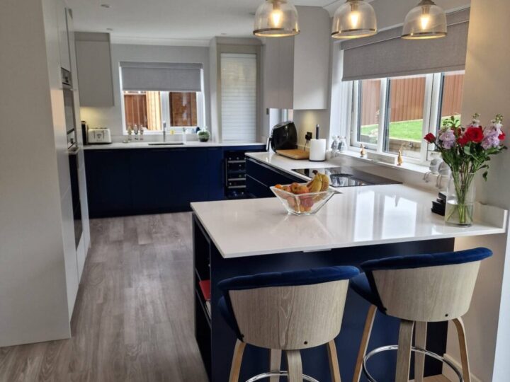 A contemporary kitchen with a functional cooking and entertainment space